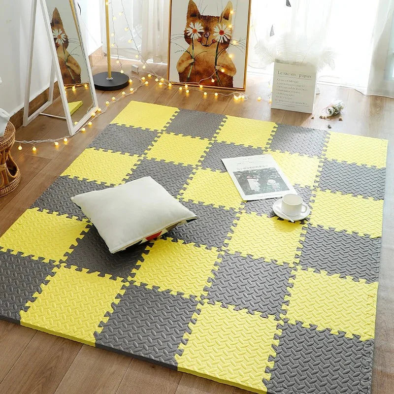 Yellow and gray checkered foam mats on a wooden floor with decorative elements.